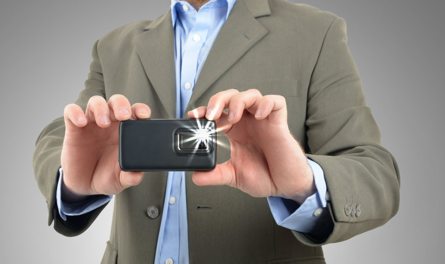 businessman taking a picture